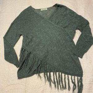 Fringe sweater with a wrap around look